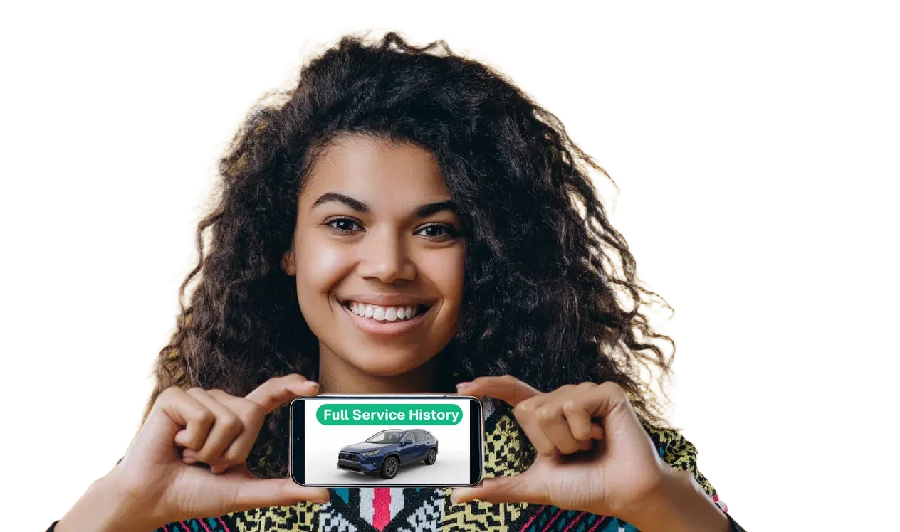 Seller holding a phone showing a Glovbox vehicle report marked Full Service History